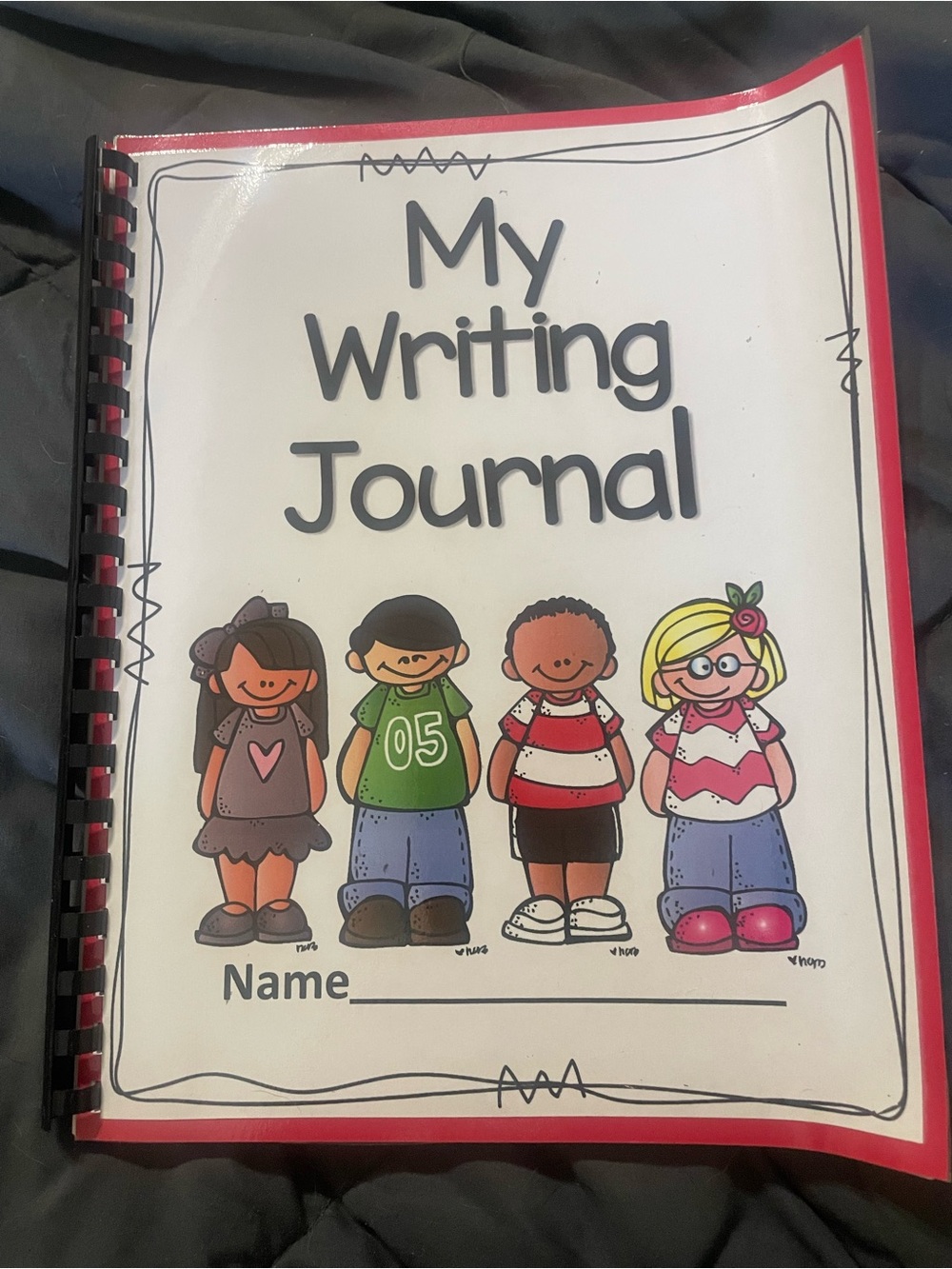 12 Writing Journals. Red laminated back and colorful front. Perfect for pre -k/k
